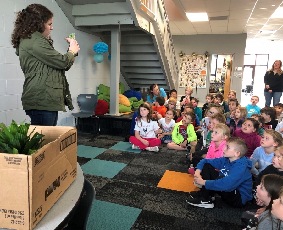 MORE LEARNING FUN IN FIRST GRADE!  Kendra Hickey, a student from the Warren County Career Centers Veterinary Science Program, came to teach first grade students about chameleons. First graders learned